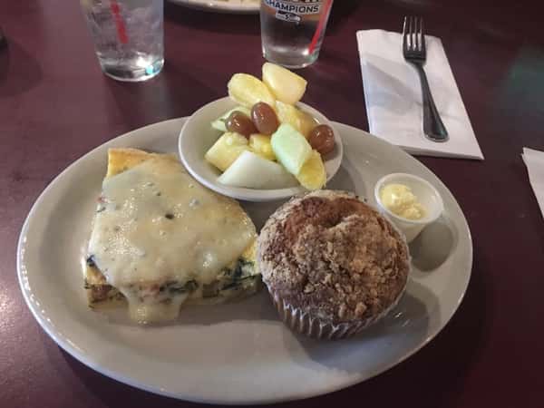 breakfats quiche dish served with fruit