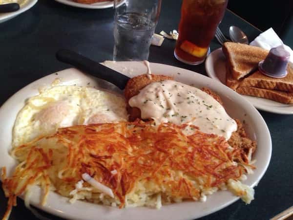 eggs benedict served with hash browns