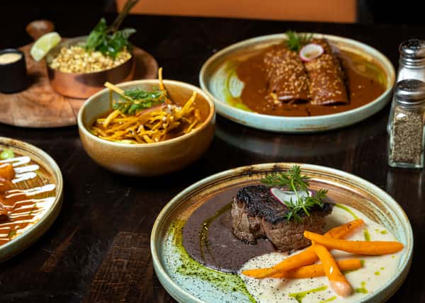 various Mexican dishes on a table
