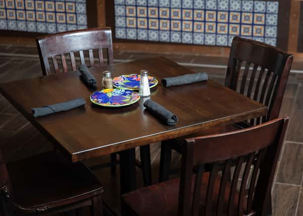 empty table with plates and silverware