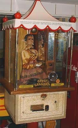 Vintage attraction of a doll in a glass display names "Gypsy Grandma"