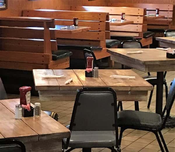 Tables at a dining area with empty seats