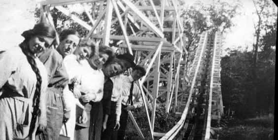 Vintage photo of people on a old roller coaster