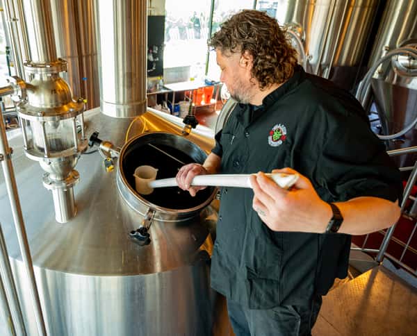 man processing beer