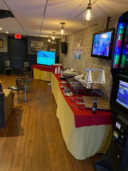 A set buffet table at a catered event in the private events room