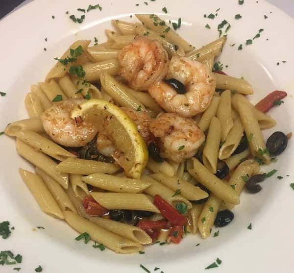 Penne in garlic and oil with sauteed vegetables and grilled shrimp on top