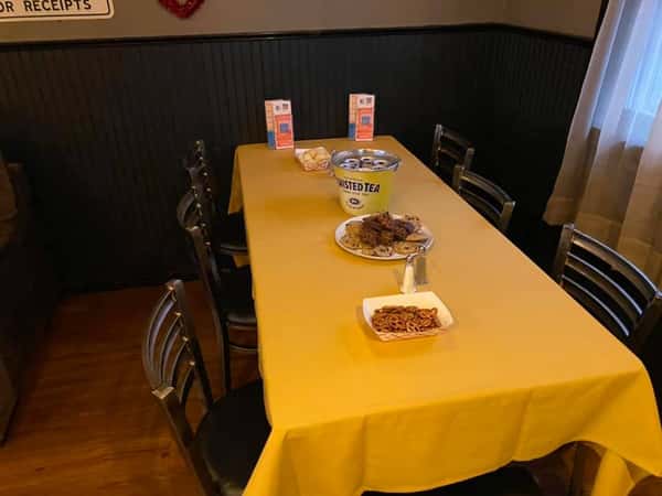 A set table with linens and appetizers at a catering event