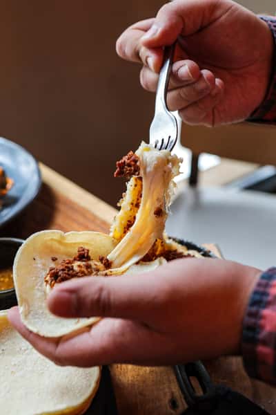 Queso Fundido, tortilla shell melted cheese taco, happy hour brunch special