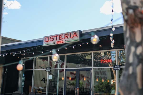 Osteria storefront with patio lights