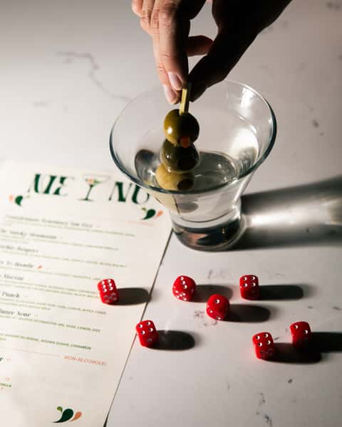 Martini with dice and menu