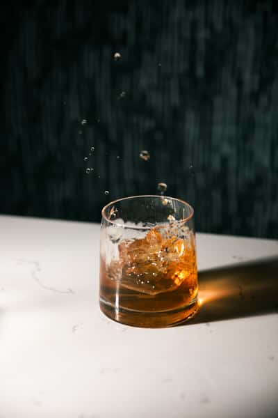 Refreshing cocktail ice cube splash