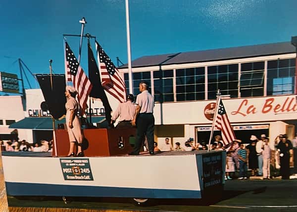1959 4th of July Parage with Float many Flags la Bella in the Backgrounf
