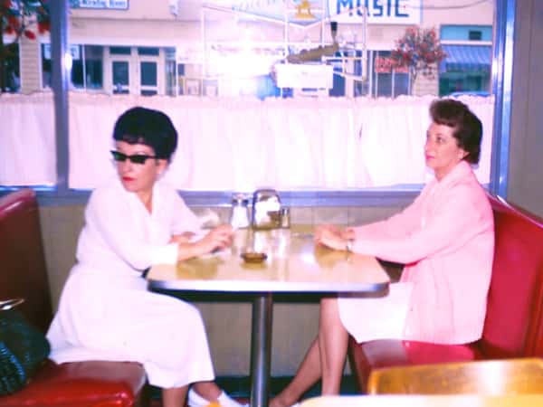 customers sitting at a booth inside
