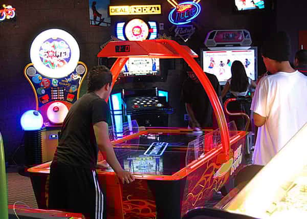 kids playing air hockey
