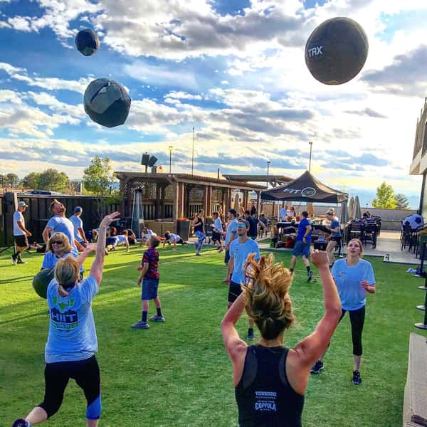 Guests participating in an outdoor fitness event on the ViewHouse lawn, featuring group workouts, open green space, and a community-focused atmosphere.