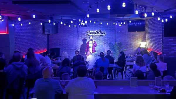 comedian on stage performing