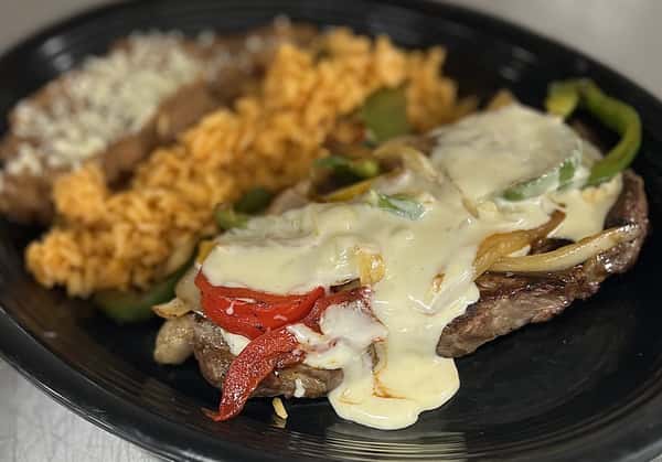 Boneless Ribeye with rice & refried beans