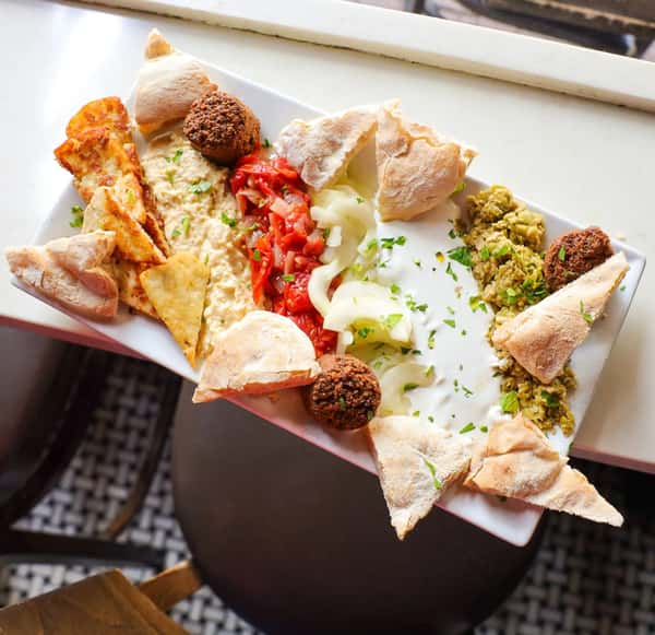 Bite sized meal with sauces and sides