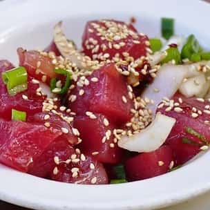 Fresh ahi tuna poke cubes tossed with sweet onions, green onions, and sesame seeds – a classic Hawaiian raw fish salad bursting with flavor."