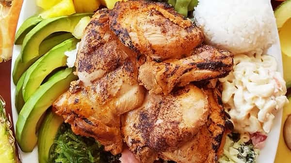 Island-style grilled chicken served with creamy macaroni salad, sliced avocado, seaweed salad, pineapple chunks, and a scoop of steamed white rice – a hearty Hawaiian fusion plate.