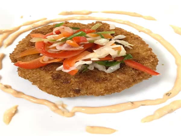 fried fish with creamy aoili and veggie cole slaw on top