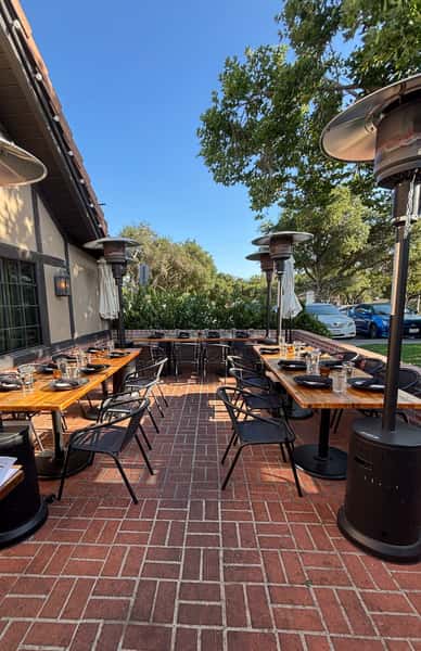 Outdoor seating area of Whiskey 'N Rye on a sunny afternoon