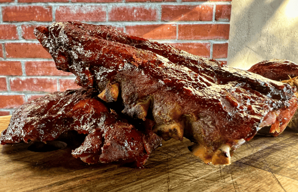 Marinated rack of ribs on a wooden board