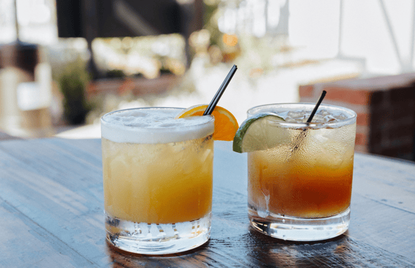 Iced drinks with fruit slices on a sunny day outside Whiskey 'N Rye restaurant