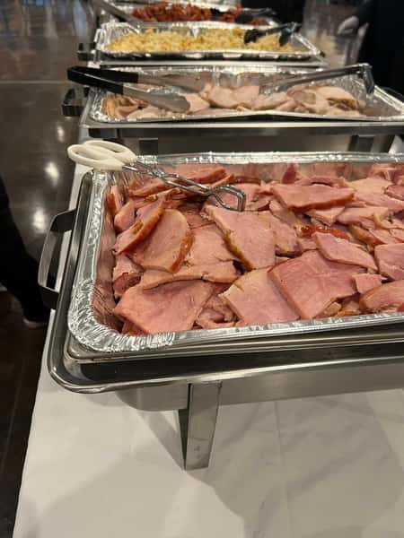 large tray of sliced ham