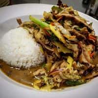 Jerk chicken stir fry with sticky rice and vegetables