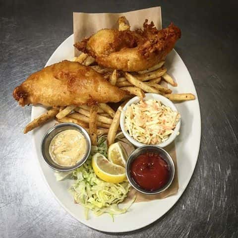 Fish & Chips platter. Beer battered haddock, fries, cole slaw served with English HP Sauce and malt vinegar.