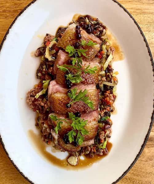Tonight our Chefs have prepared a Roasted Pekin Duck Breast with dirty wild rice, foie gras sausage, sea island red peas, shaved brussels, and huckleberry jus. We have a limited amount to sell so don’t miss out. #atleats #huckleberry #foiegras #duckbreast