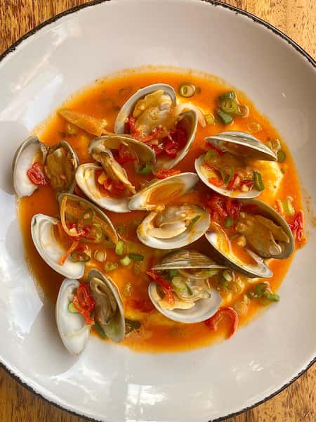 Join us this weekend and try our appetizer special: Steamed Sapelo Clams with aji dulce pepper, green onion, and creamy polenta! #atleats #atfoodie #sapeloclams