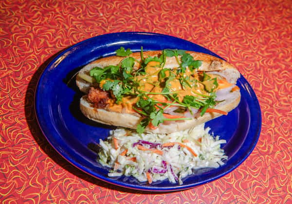 On a toasted sub roll, we stack crispy fried tofu, mushroom pâté, Vietnamese BBQ sauce, housemade kewpie mayo, pickled carrots, onion, cucumbers, and plenty of cilantro.