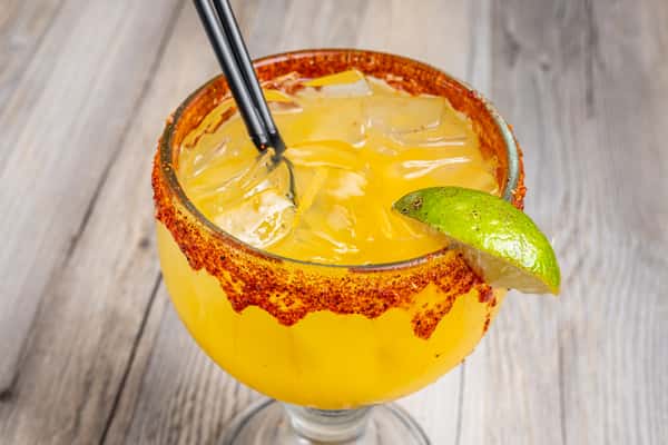 Mango Margarita in a glass with a wedge of lime