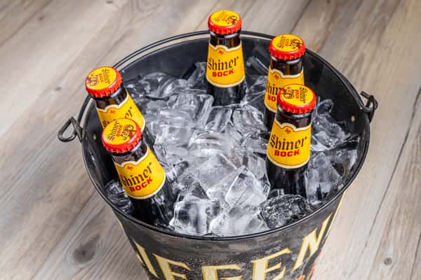 Bucket of ice-cold Shiner Bock beers at Spechts Texas Bar & Grill, a historic Texas saloon near San Antonio.