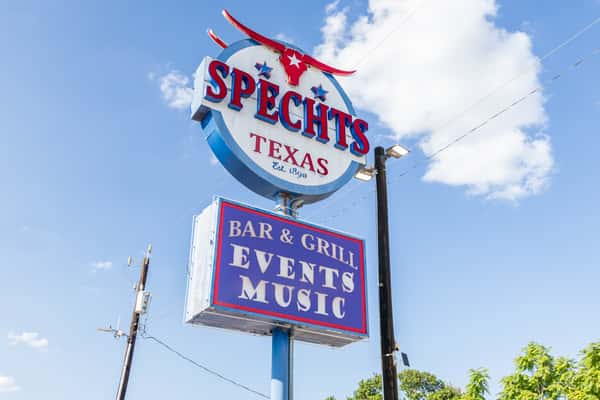 Exterior sign for Spechts Texas advertising Events and Music