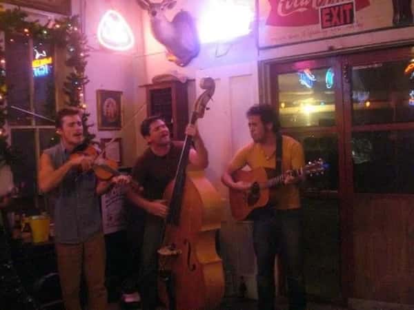 Three person band performing