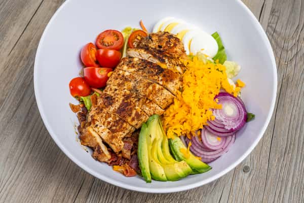 Texas-style Cobb salad with grilled chicken, avocado, tomatoes, egg, cheese, onion, and dressing at Spechts Texas Bar & Grill.