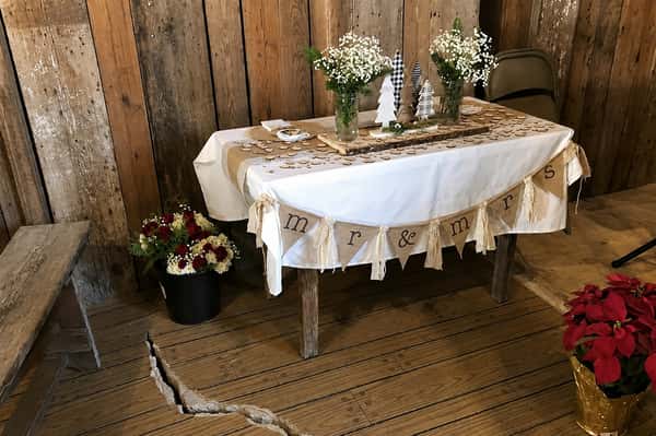 Rustic barn with a mr and mrs display on a table