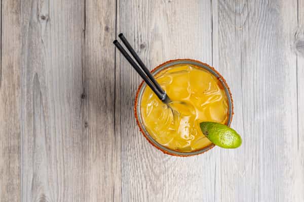 Mango margarita with a seasoned rim and fresh lime at Spechts Texas Bar & Grill in the San Antonio area.