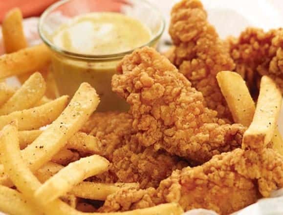 chicken tenders with a side of fries and dipping sauce