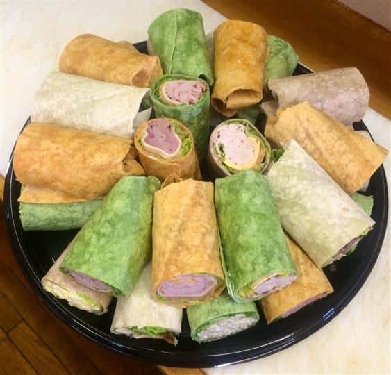 Chicken and ham wraps stacked on top of each other