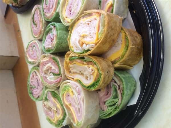 Turkey and Ham wraps stacked on each other