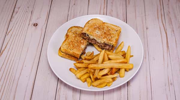Grilled rye, ground beef patty, sautéed onions, and Swiss cheese