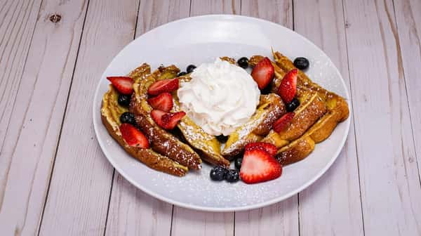 Fluffy thick style French toast topped with fresh seasonal berries