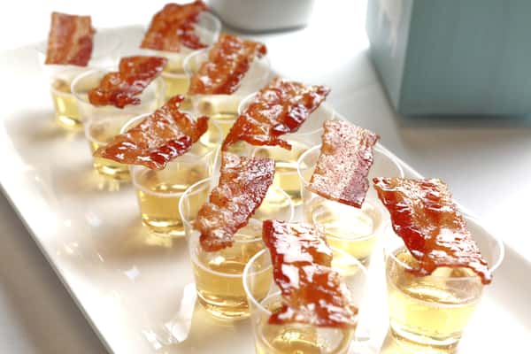 cider cups with piece of bacon on top