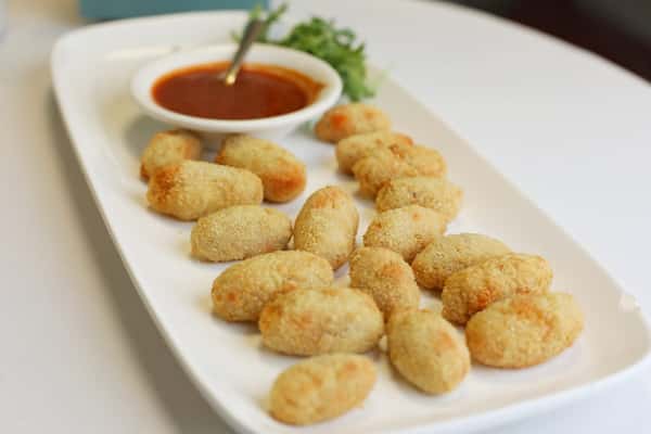 white tray with little fried bites