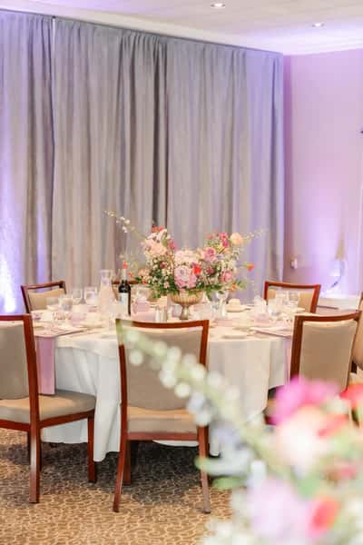 chairs in ballroom around a table