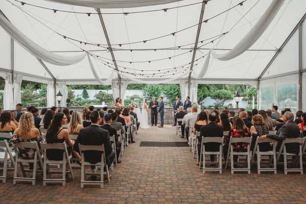 tent with white chairs